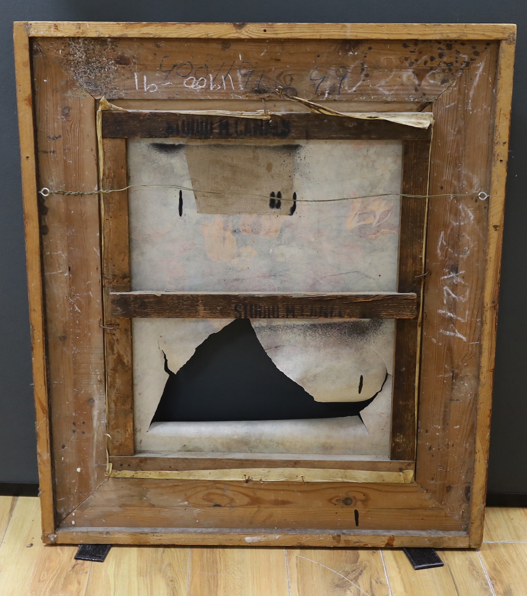 A carved giltwood Studio M. Canels picture frame, aperture 59 x 47cm (a.f.)
